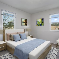 beautiful bed in a spacious bedroom at Hanover Courts Apartments, located in Washington, DC